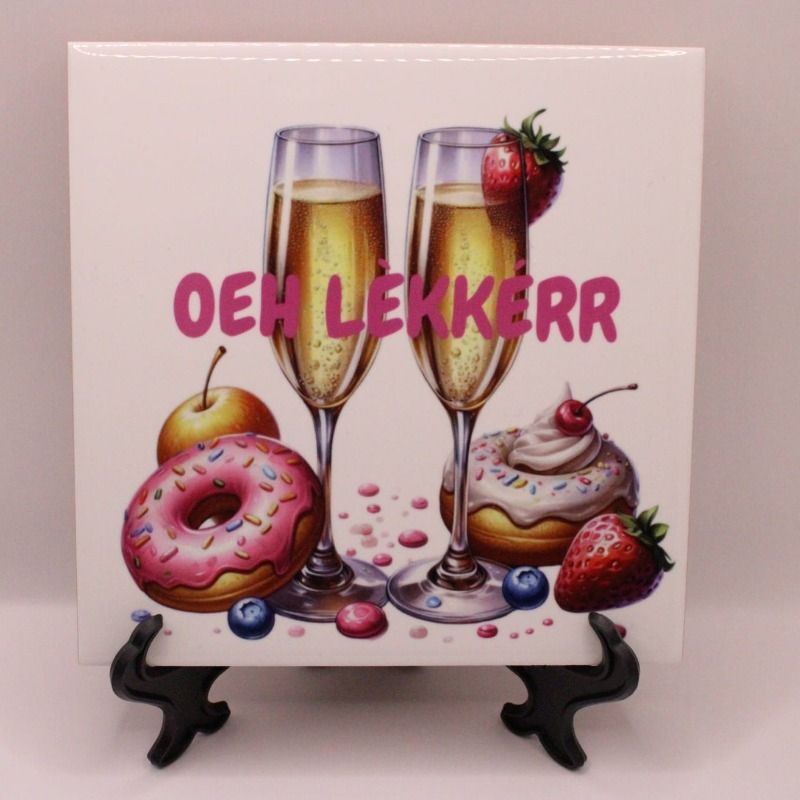 Bestel nu dit leuke tegeltje met de opdruk van champagne glazen en daarom heen lekkernijen, en met de tekst OEH LEKKERR, het tegeltje is 15 x 15 cm met een glanzende afwerking en naar wens te bedrukken
